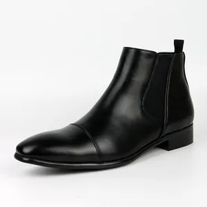 Side view of classic black leather Chelsea boots for men with elastic side panels