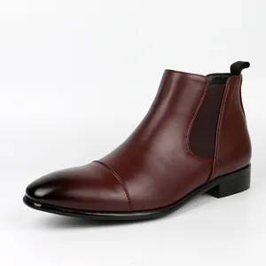 Detailed side view of a retro burgundy men's Chelsea boot with a black gradient toe