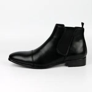 Detailed side view of classic black leather Chelsea boots for men with elastic panels.
