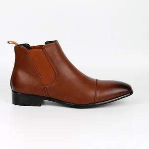 Side profile view of high-quality vintage brown faux leather Chelsea boots for men