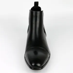 Front detail view of a classic black leather Chelsea boot for men with square toe design