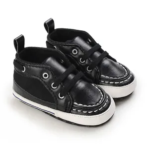 Premium black soft sole baby walker shoes with lace-up detail and sturdy white base