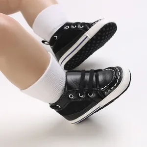 Black synthetic leather baby pre-walker shoes with soft soles and white stitching