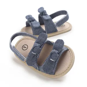 Soft blue denim baby sandals featuring double bow knots and a supportive back strap