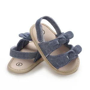 Comfortable soft sole blue denim baby sandals featuring a cute bow design for infants aged 0-1