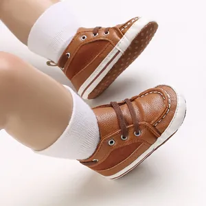 Detail view of brown lace-up baby walker shoes with soft sole and white stitching.