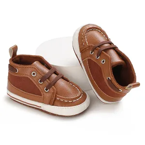 Detailed view of brown infant walking shoes with soft soles and classic lace-up style