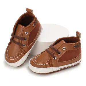Close-up of brown soft-sole baby walking shoes for infants aged 0-1 year.
