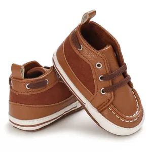 Detailed close-up of brown infant walking shoes with soft soles and lace-up design