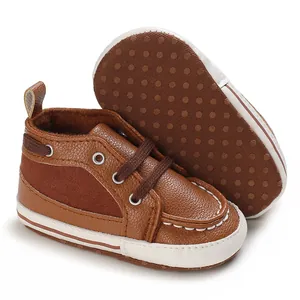 Close-up detail of brown soft sole baby walking shoes featuring anti-slip dotted bottom