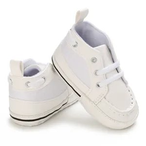 Comfortable white soft-sole baby pre-walker shoes with a classic lace-up design