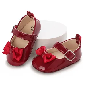Elegant red patent leather baby princess walking shoes with bow detail for infants