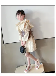 Girl wearing stylish white Roman sandals with rhinestone straps for summer resort look