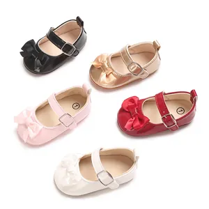 Macro view of newborn girl princess walking shoes with decorative bows in five colors