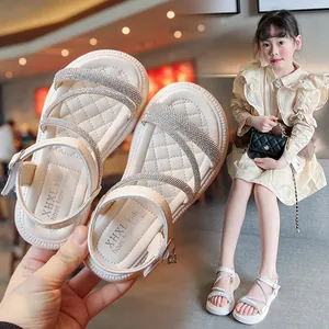 Girl's stylish summer Roman sandals with shimmering rhinestone straps and soft soles.