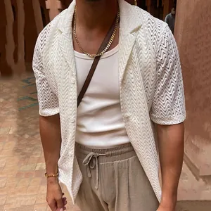 Detailed view of white hollow-out knit short sleeve shirt for men with zigzag mesh
