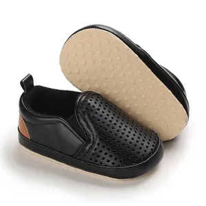 Close-up detail of black PU leather soft-sole baby walking shoes with anti-slip bottom