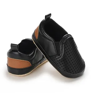 Detailed view of breathable perforated black PU leather baby walking shoes