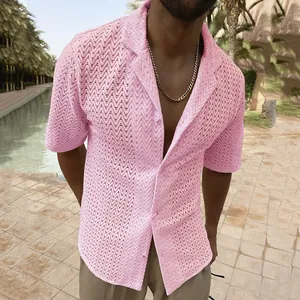 Close-up detail of a men's pink hollow-out knit shirt featuring a stylish wave pattern