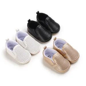 Soft PU leather baby shoes with perforated design and anti-slip soles for toddlers.