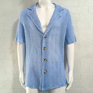 Close-up detail of light blue hollow-out knit texture on a men's lapel collar shirt