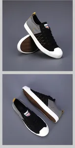 Vue détaillée de baskets en toile noires et grises pour hommes avec semelles blanches.