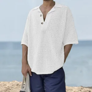 Detailed macro view of a white hollow-out knit polo shirt with lapel and button detail