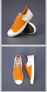Vues détaillées de baskets en toile orange et blanches pour hommes avec semelles plates