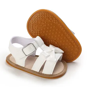 White baby girl sandals with glossy bow decoration and non-slip rubber star-patterned sole