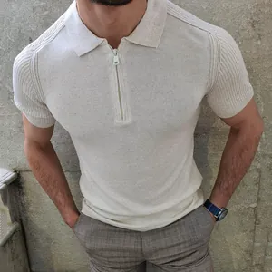 Detail view of a men's slim-fit beige knit polo shirt with a textured zipper collar.