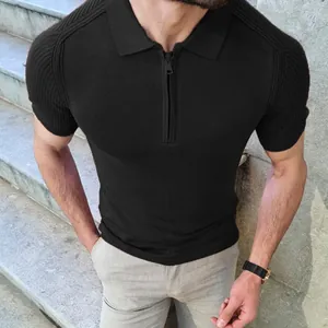 Close-up detail of slim fit black knitted polo shirt with front zipper and ribbed sleeves
