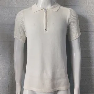 Close-up view of a white slim fit knit polo shirt with zipper collar and textured sleeves