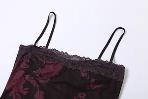 Close-up of vintage floral camisole dress featuring elegant purple lace trim detail.
