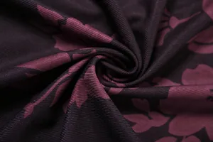 Close-up macro view of vintage floral print fabric texture with ribbed details on dress