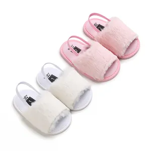 Macro detail view of pink and white plush faux fur baby sandals for infant girls