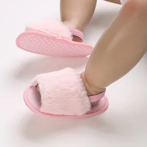 Close-up of soft pink furry baby girl sandals with elastic back strap