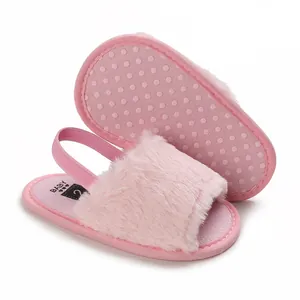 Close-up of pink faux fur baby sandals with elastic back strap and anti-slip sole