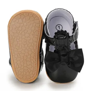 Black patent leather baby princess shoes with bow detail and textured soft sole