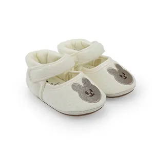 Detail shot of breathable anti-slip baby princess shoes with cute rabbit embroidery and strap.