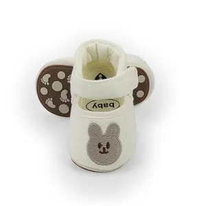 Close-up of cream baby princess walker shoes with cute bear embroidery and anti-slip sole