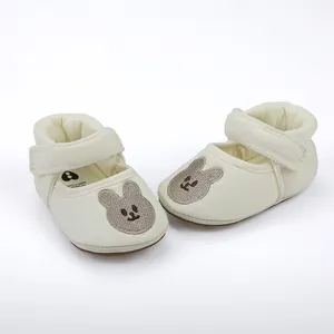 Detailed view of cream baby princess shoes with cute rabbit embroidery and strap