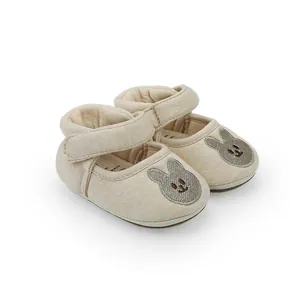 Close-up of breathable beige baby walking shoes with cute rabbit embroidery detail