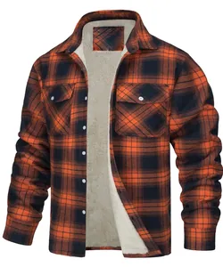 Macro view of the thick warm fleece lining and orange plaid fabric of the men's jacket