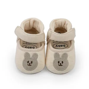 Soft beige baby pre-walker shoes with cute bunny embroidery and adjustable velcro strap.