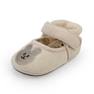Close-up of breathable baby walking shoe with cute bunny embroidery and velcro strap