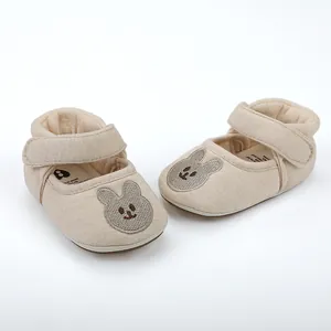Detailed texture of breathable non-slip baby shoes with cute rabbit embroidery detail