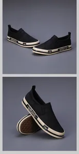 Macro detail of black canvas slip-on loafers with stylish graphic sole designs