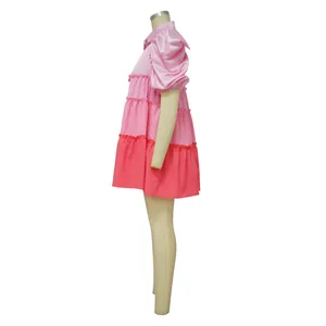Side view of tiered satin dress with pink color-blocking and puff sleeves