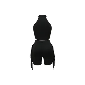 Rear view of stylish black two-piece outfit featuring a halter top and fringed shorts.