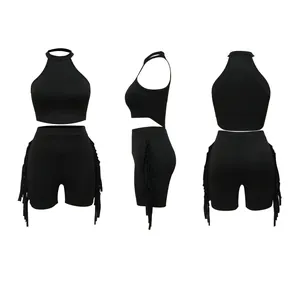 Black sleeveless halter neck crop top and fringe shorts two-piece outfit detail views.